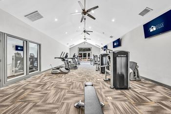 A gym with cardio machines